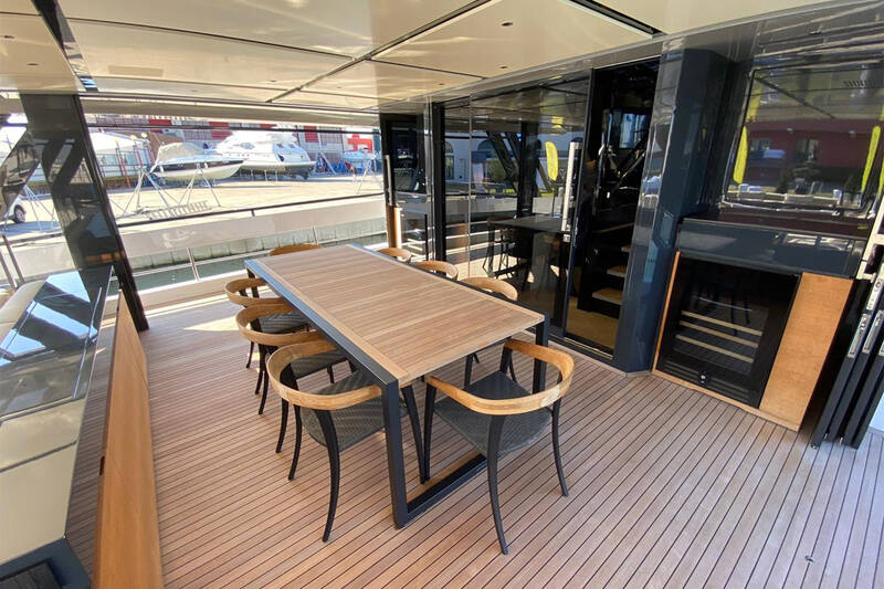 Dining area on main deck with sliding doors on sides