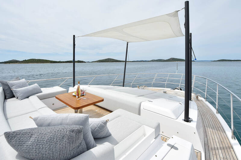 Seating area and sunbathing cushions on bow