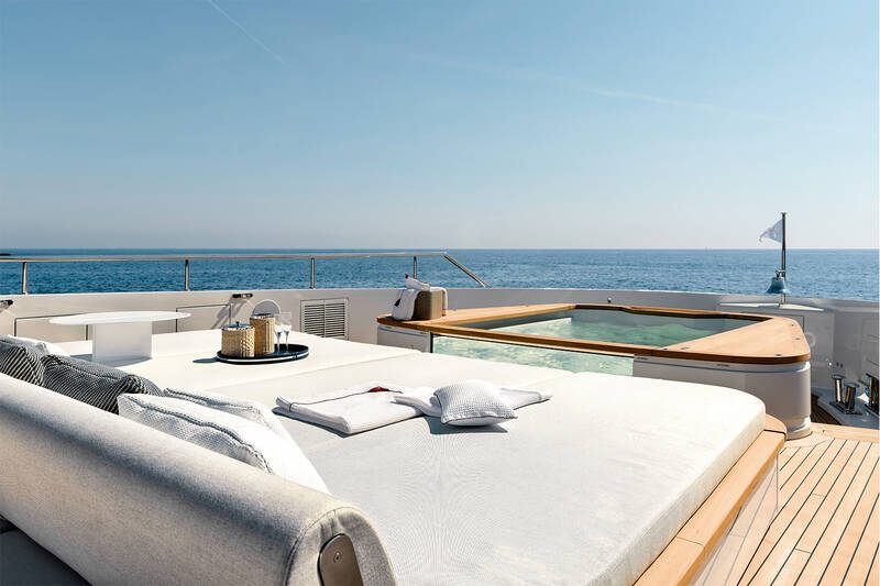 Sunbathing cushions and jacuzzi on bow upper deck