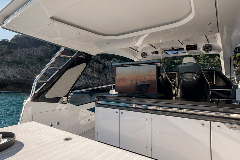 Wet bar on aft of the wheelhouse with ice maker and fridge