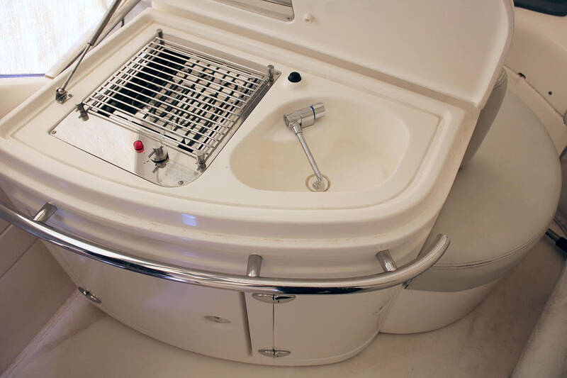 Wet bar with sink and BBQ on flybridge